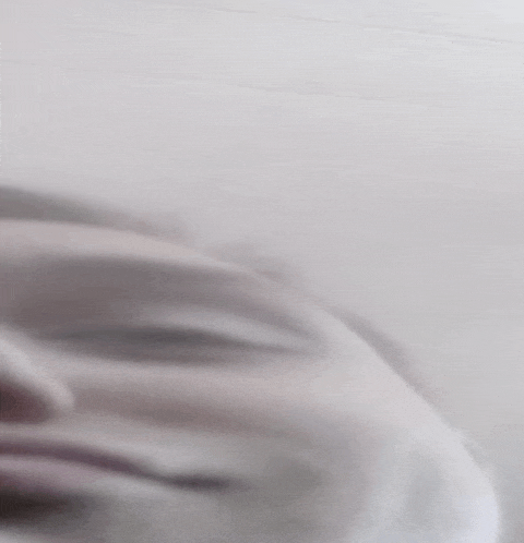 a close up of a person 's face on a white background .