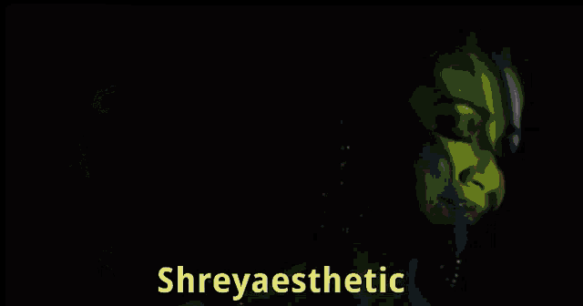 a woman in a dark room with the word shreyaesthetic on the bottom right