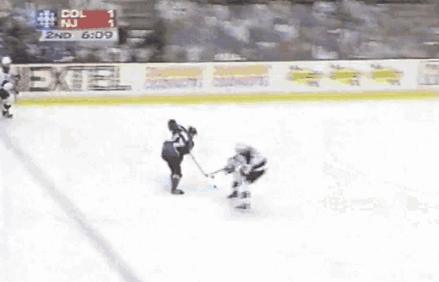 a hockey game is being played with the scoreboard showing col 1 and nj 1
