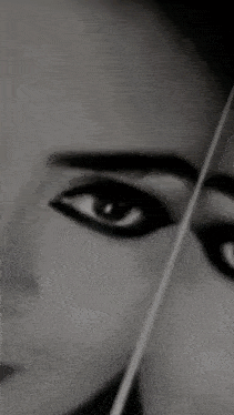 a close up of a woman 's face with a smile on her face .