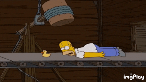 a cartoon of homer simpson laying on a conveyor belt with the words protect the duck above him