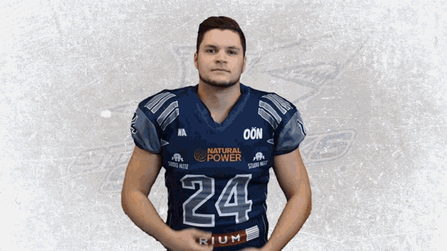 a man wearing a blue jersey with the number 24