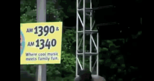 a yellow sign that says am 1390 and am 1340