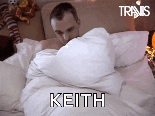 a man laying in bed with the name keith written on the bottom