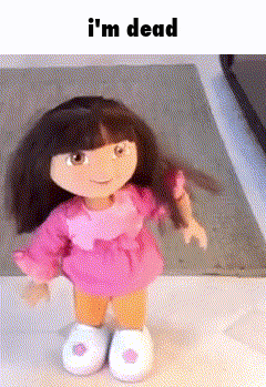 a doll is standing on a table with the words i 'm dead above her