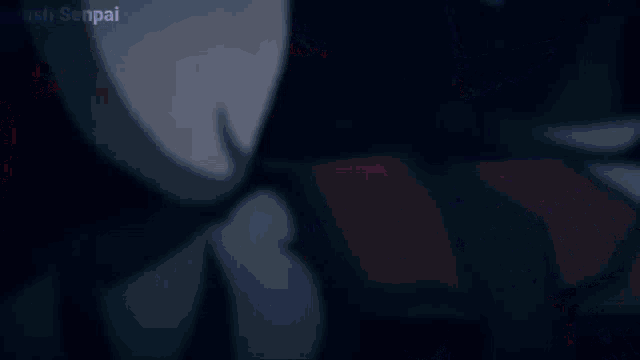 a blurred image of a person 's face with the words ayush senpai written on the bottom