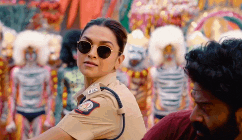 a woman in a police uniform has the letters ips on her uniform