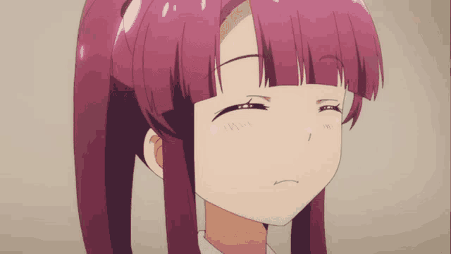 a close up of a girl with purple hair making a face