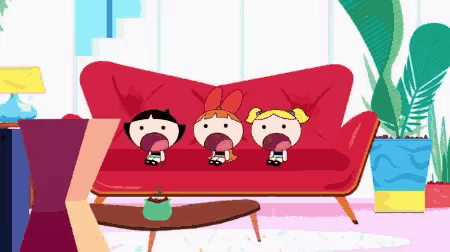 three cartoon characters are sitting on a red couch with their mouths open