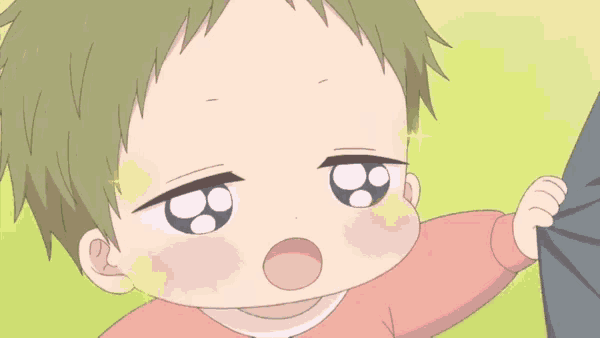 a baby is standing next to a person in a pink shirt and looking at the camera .