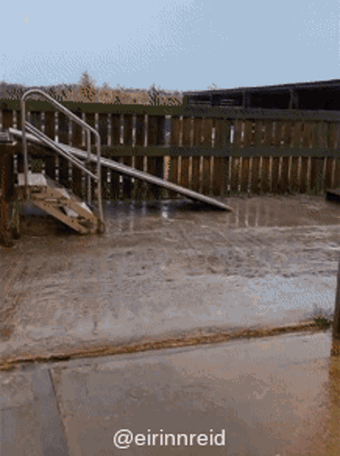 stairs leading up to a wooden fence with a caption that says @eirinnreid