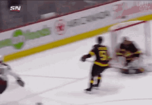 a hockey player with the number 55 on his back
