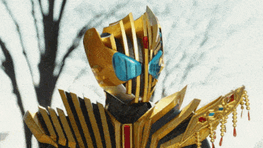 a gold and black costume with blue eyes and a crown
