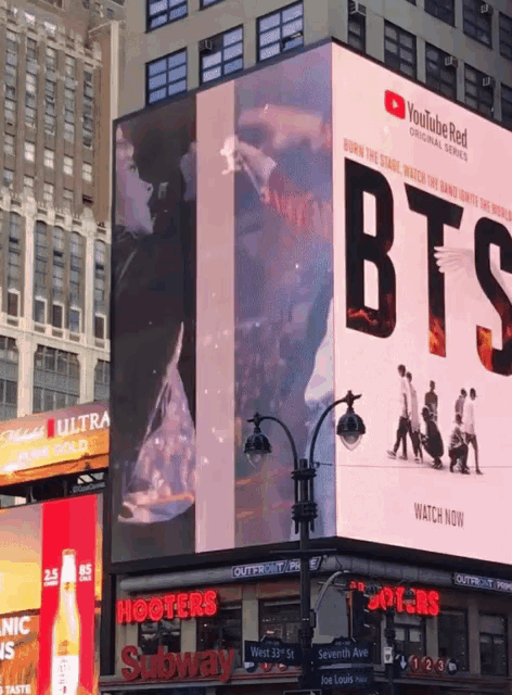 a large billboard for youtube red shows a group of people walking
