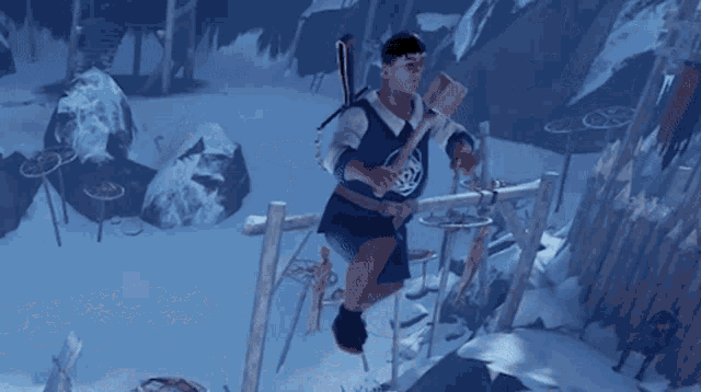 a man in a blue and white shirt is sitting on a wooden post in the snow