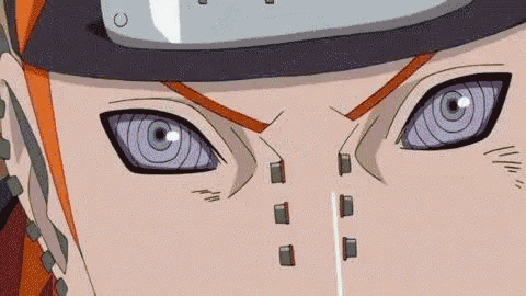 a close up of a person 's eyes with purple eyes and a helmet on .
