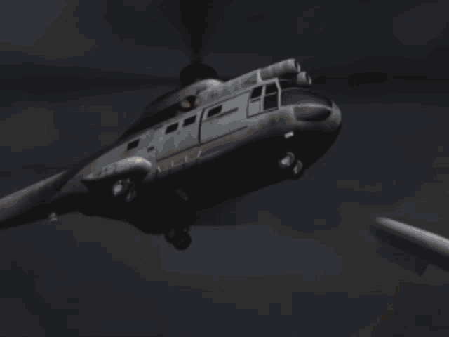 a helicopter is flying through the air with flames coming out of it 's tail