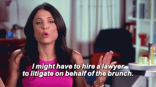 a woman in a pink top is talking about hiring a lawyer to litigate on behalf of a brunch .