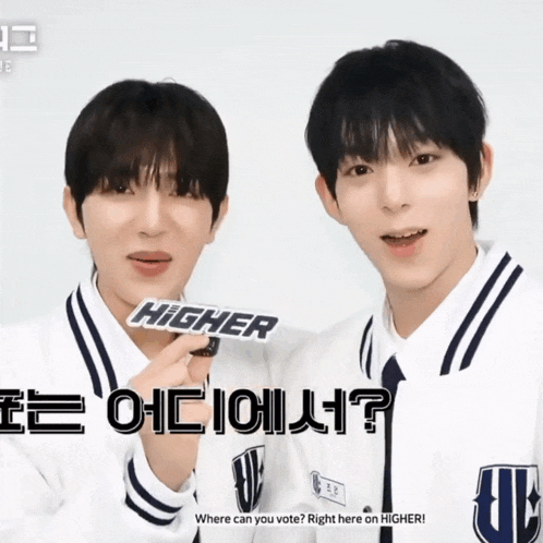two boys are standing next to each other with a sign that says higher