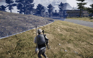 a man with a backpack and a gun walks down a dirt road in front of a building that says tech motors