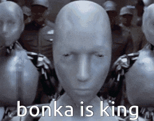 a group of mannequins are standing next to each other with the words bonka is king written on them .
