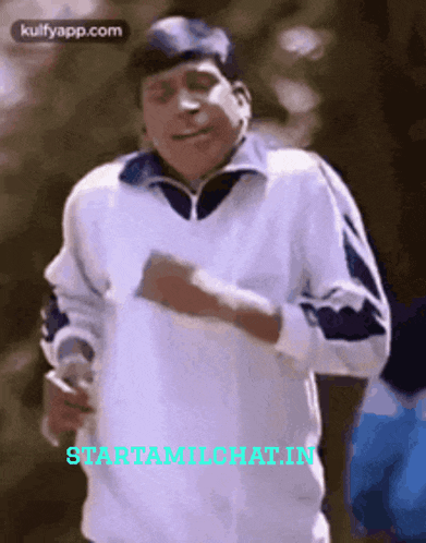 a man in a white sweater is dancing with the words startamilchathin on the bottom right