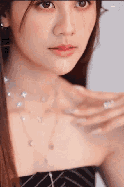a close up of a woman 's face and neck