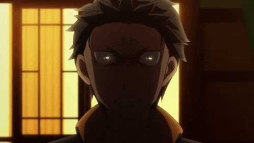 a close up of a man 's face with his eyes glowing in the dark