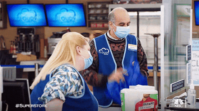 a man wearing a blue vest that says cloud on it