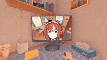 a computer monitor is on a desk next to a box of tissues