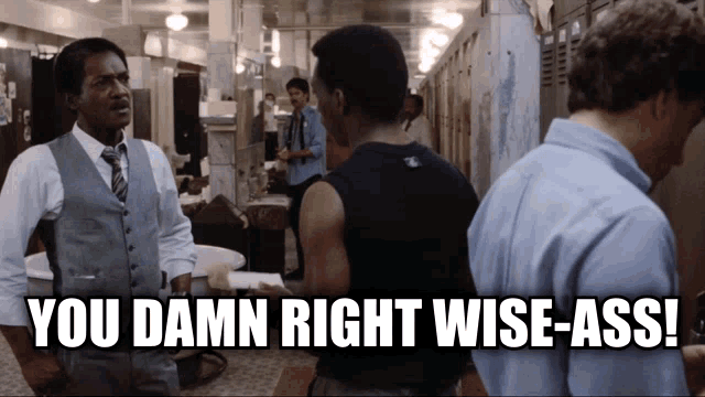 a group of men standing in a hallway with the caption " you damn right wise-ass " above them