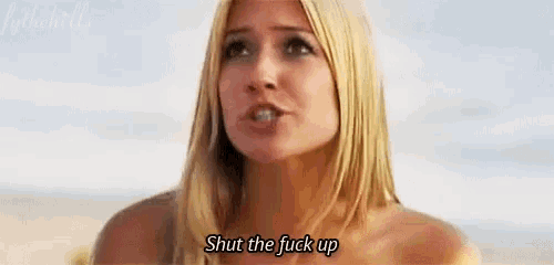 a woman without a shirt says shut the fuck up