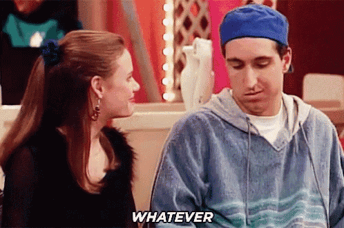 a man and a woman are sitting next to each other and the man is saying whatever