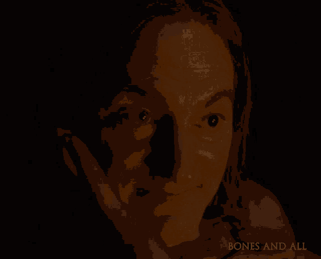 a close up of a person 's face with the words bones and all visible