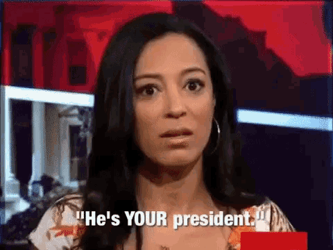 a woman says " he 's your president " while looking at the camera