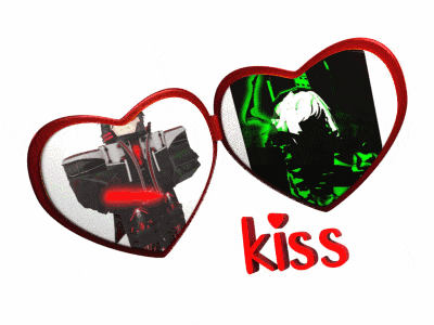 two red hearts with a picture of a man and the word kiss