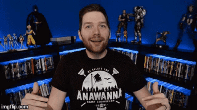 a man wearing a black shirt that says anawanna