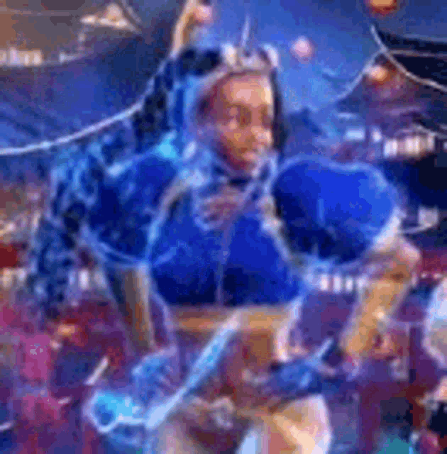 a woman in a blue costume is dancing in front of a crowd in a video game .