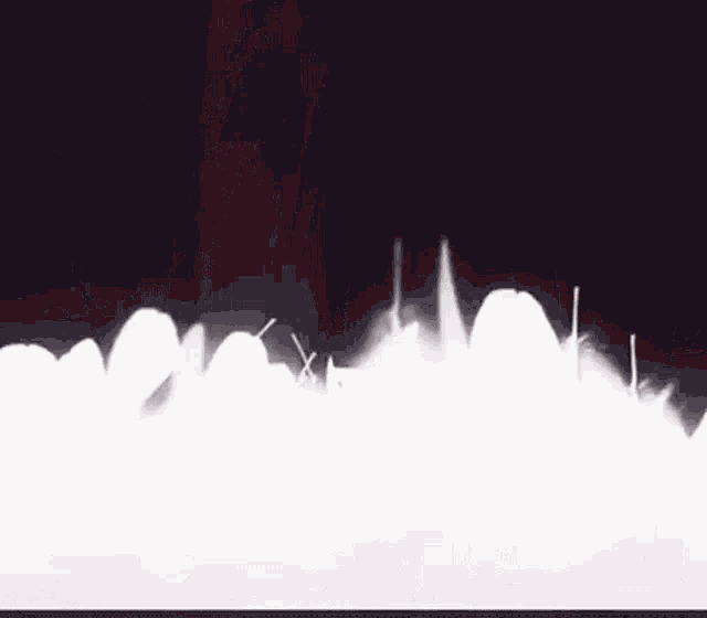a pixelated image of a person 's foot walking on a red surface