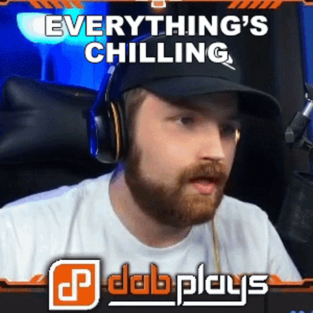 a man wearing headphones and a hat with the words everything 's chilling