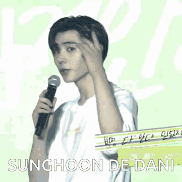 sunghoon de dani is holding a microphone in front of a green background