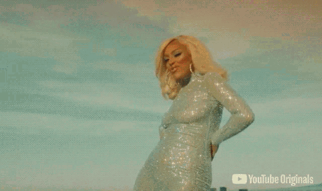 a woman in a red dress is on a youtube originals video