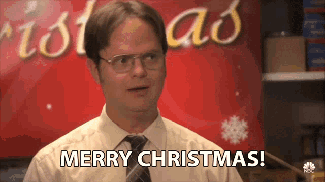 a man in a tie says merry christmas
