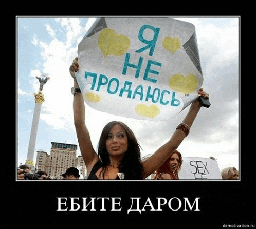 a woman holds up a sign that says sex in russian