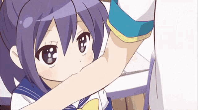 a girl with purple hair is holding a man 's arm in a sailor suit .