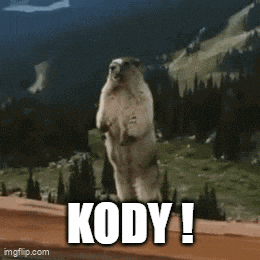 a squirrel is standing on its hind legs with the words kody written on the bottom