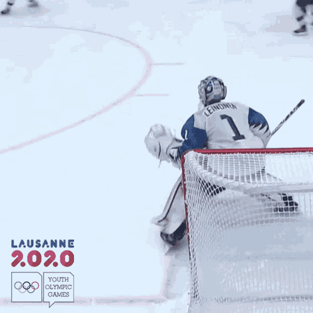 a hockey goalie with the number 1 on his shirt