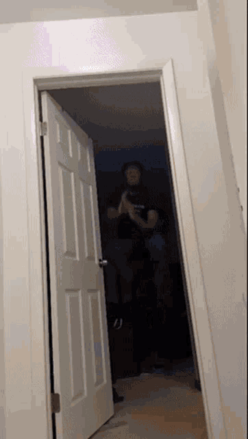a man taking a picture of himself in an open door