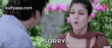 a man and a woman are talking and the woman is saying sorry .