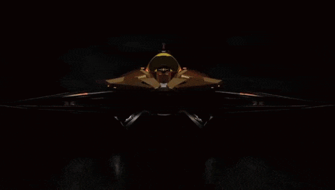 a close up of a jet engine with a red flame